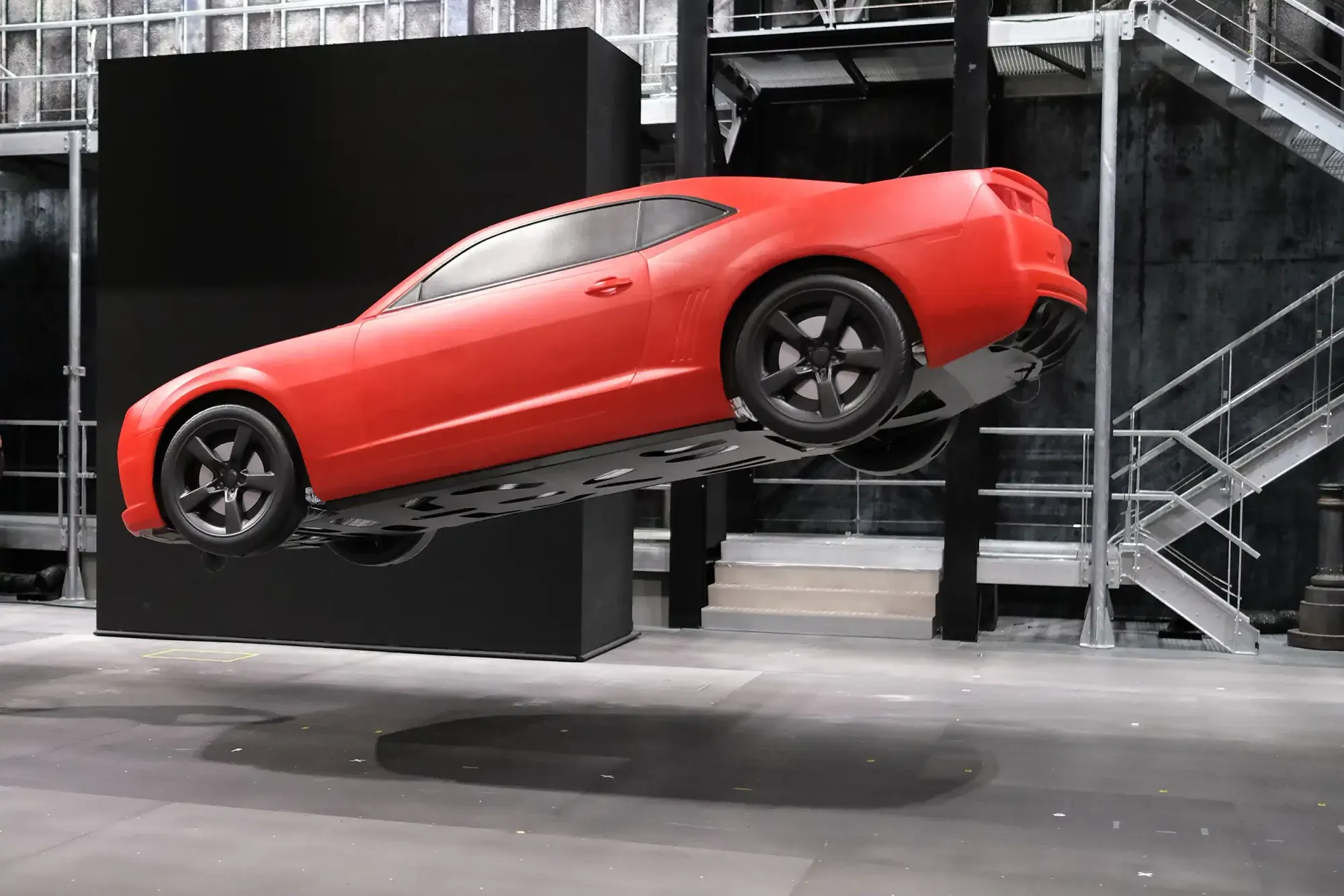A red car flying above the stage during the Marvel Avengers show at Disneyland Paris