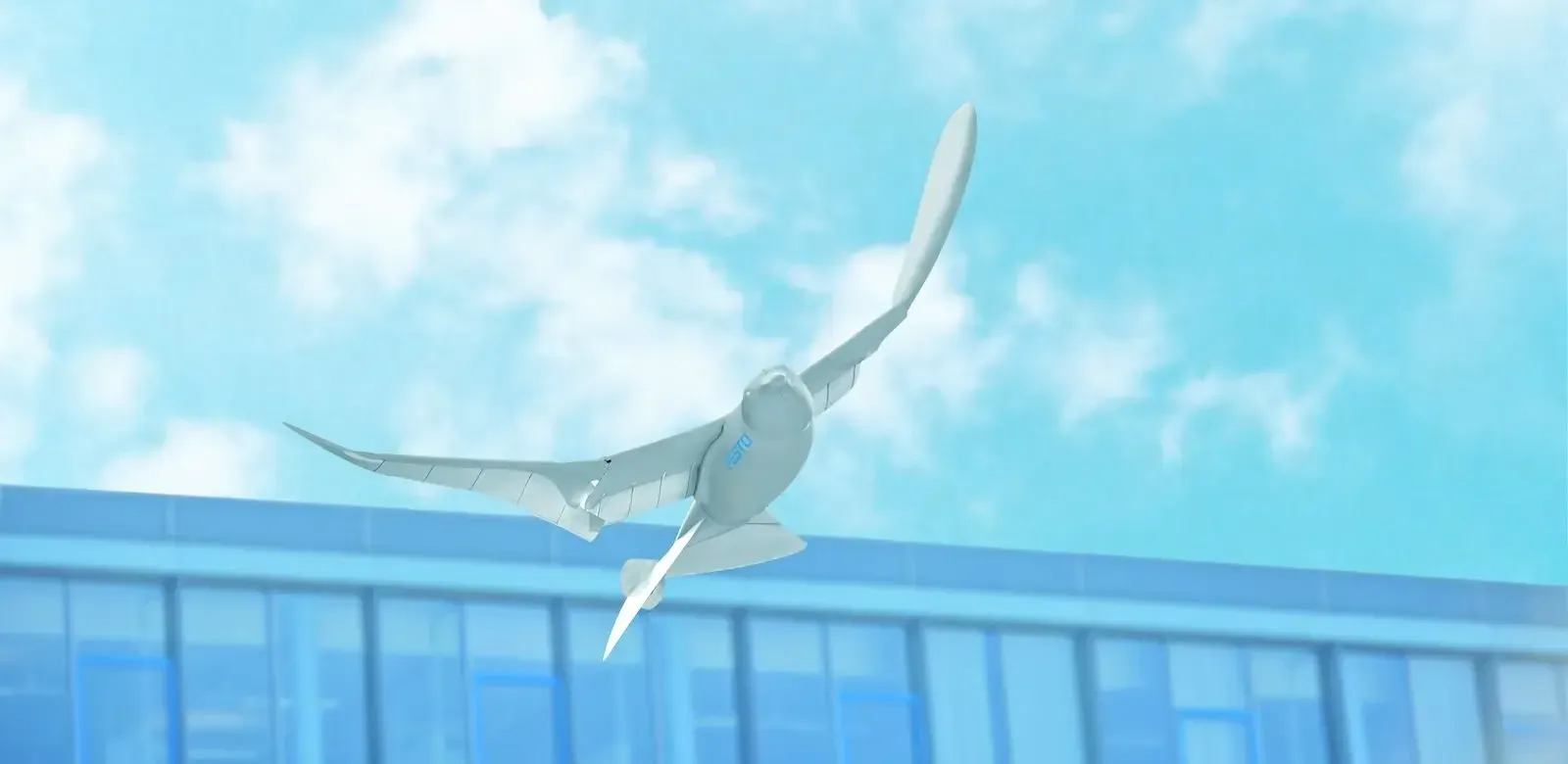 The SmartBird robotic seagull flying against a blue sky