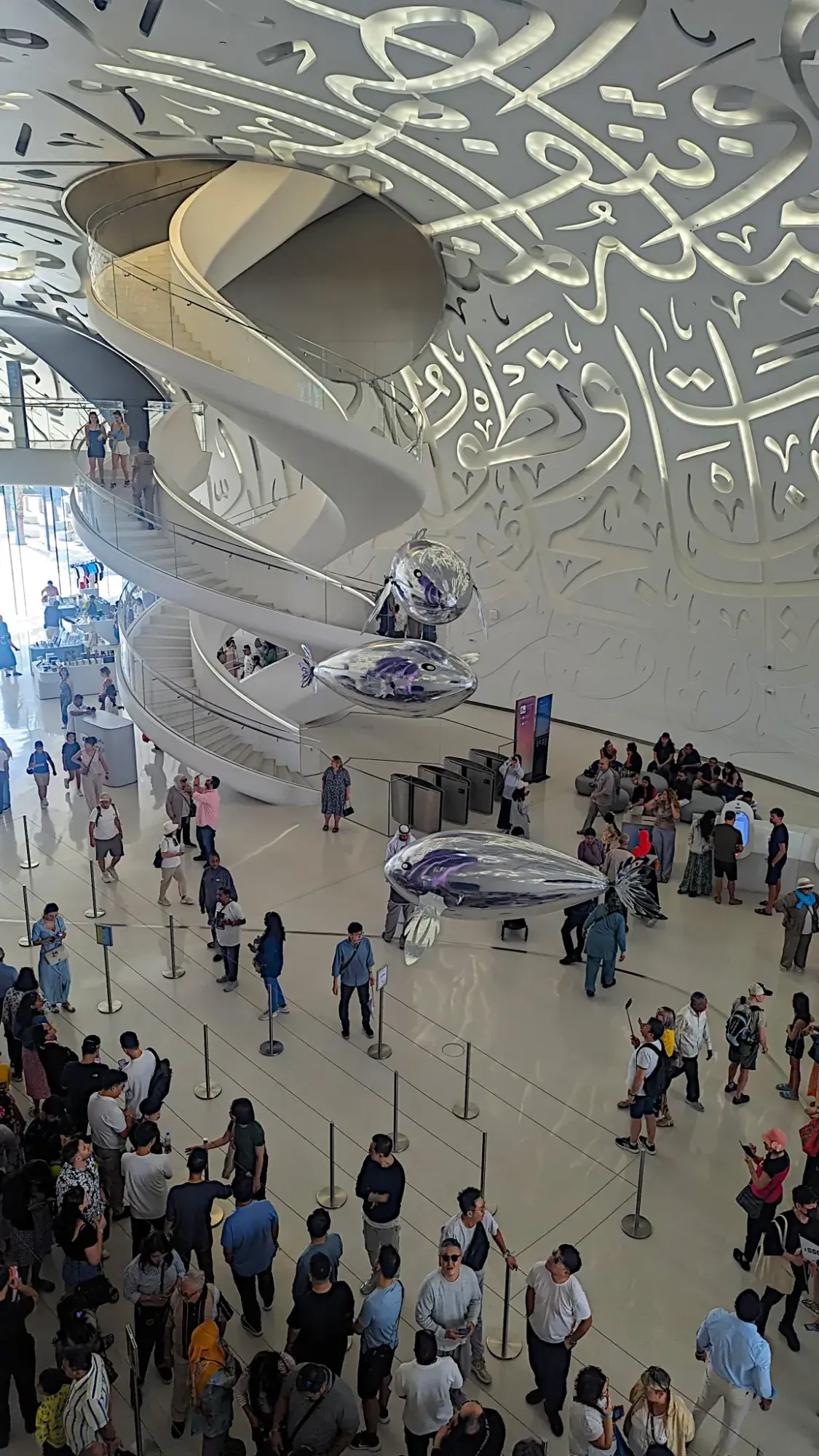 Autonomous flying fish floating above visitors inside the Museum of the Future in Dubai